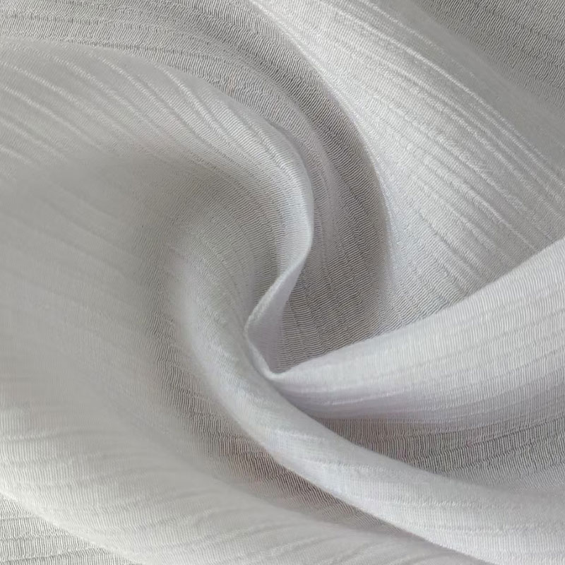 Sterk gedraaide 4:1 single-filament rayon/nylon stof met kreukeltextuur